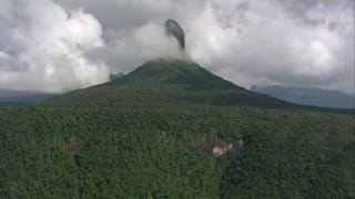 AF0001_000577 - HD aerial stock footage zoom out to a wider view of mountain peaks covered with jungle in Southern Venezuela