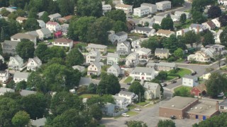 AF0001_000699 - HD aerial stock footage of flying by a suburban neighborhood, Readville, Massachusetts