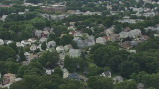 AF0001_000705 - HD aerial stock footage flyby a suburban residential neighborhood, Hyde Park, Massachusetts
