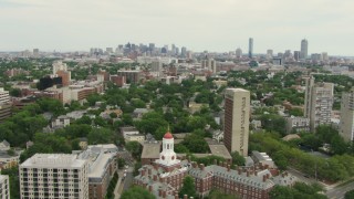AF0001_000725 - HD stock footage aerial video fly over Dunster House at Harvard University to approach Cambridge and Downtown Boston, Massachusetts
