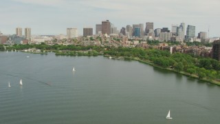 AF0001_000741 - HD aerial stock footage approach Charles River Esplanade, Beacon Hill, and the city skyline, Downtown Boston, Massachusetts