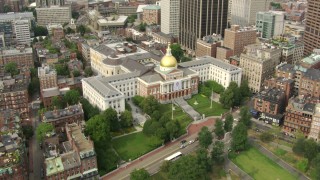 AF0001_000746 - HD aerial stock footage tilt from Boston Common to reveal the Massachusetts State House in Downtown Boston, Massachusetts