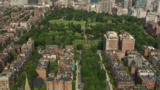AF0001_000759 - HD stock footage aerial video fly over Victorian brownstone homes, reveal Boston Common and Downtown Boston, Massachusetts
