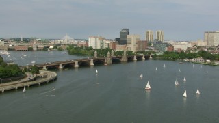 AF0001_000783 - HD aerial stock footage fly over sailboats on the Charles River to approach the Longfellow Bridge, Boston, Massachusetts