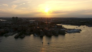 AF0001_000787 - HD aerial stock footage flyby wharfs and the United States Coast Guard Base on the North End, Downtown Boston, Massachusetts, sunset