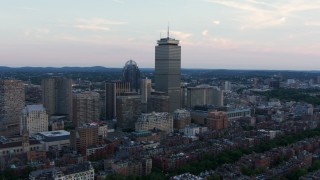 AF0001_000807 - HD aerial stock footage approach 111 Huntington Avenue and Prudential Tower in Downtown Boston, Massachusetts, twilight
