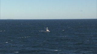 AF0001_000823 - HD aerial stock footage of a fishing boat sailing the Atlantic Ocean