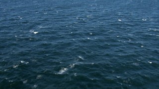 AF0001_000824 - HD stock footage aerial video of a reverse view of the surface of the Atlantic Ocean