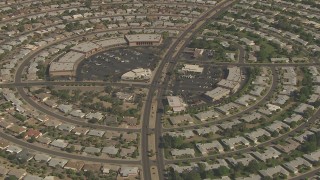 AF0001_000834 - HD aerial stock footage of La Ronde Shopping Center circled by homes in Sun City, Arizona