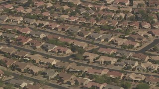 AF0001_000844 - HD aerial stock footage of rows of one-story tract homes in Surprise, Arizona