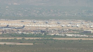 AF0001_000848 - HD aerial stock footage of an aircraft boneyard at Davis Monthan AFB, Tucson, Arizona