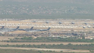 AF0001_000849 - HD aerial stock footage of a military aircraft boneyard, Davis Monthan AFB, Tucson, Arizona