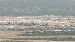 AF0001_000850 - HD aerial stock footage of a view of airplanes at an aircraft boneyard, Davis Monthan AFB, Tucson, Arizona