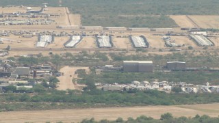 AF0001_000851 - HD aerial stock footage flyby planes at an aircraft boneyard, Davis Monthan AFB, Tucson, Arizona