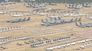 AF0001_000853 - HD aerial stock footage pan across aircraft parked at the boneyard at Davis Monthan AFB, Tucson, Arizona
