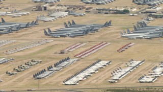 AF0001_000854 - HD stock footage aerial video of groups of military airplanes in an aircraft boneyard, Davis Monthan AFB, Tucson, Arizona