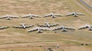 AF0001_000859 - HD aerial stock footage of flying by rows of bomber jets at an aircraft boneyard, Davis Monthan AFB, Tucson, Arizona