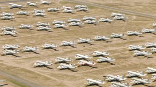 AF0001_000860 - HD aerial stock footage of military propellor airplanes at the aircraft boneyard, Davis Monthan AFB, Tucson, Arizona