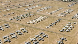 AF0001_000861 - HD aerial stock footage of military jet and prop airplanes at an aircraft boneyard, Davis Monthan AFB, Tucson, Arizona