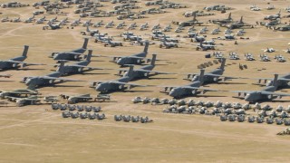 AF0001_000865 - HD aerial stock footage military airplanes and helicopters at the aircraft boneyard, Davis Monthan AFB, Tucson, Arizona