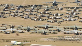 AF0001_000867 - HD stock footage aerial video of reverse view of military airplanes at an aircraft boneyard, Davis Monthan AFB, Tucson, Arizona