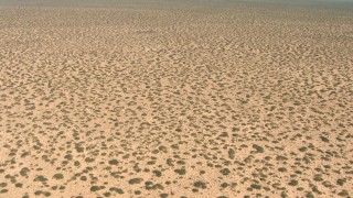 AF0001_000897 - HD stock footage aerial video of descending toward a desert plain in New Mexico