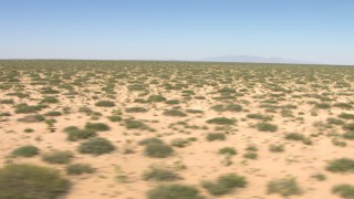 AF0001_000903 - HD stock footage aerial video flyby desert vegetation in a wide plain in New Mexico