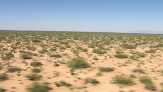 AF0001_000904 - HD stock footage aerial video flyby a wide desert plain in New Mexico