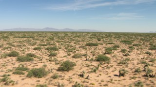 AF0001_000906 - HD stock footage aerial video of desert vegetation on a wide plain in New Mexico