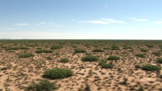 AF0001_000909 - HD stock footage aerial video of a view across a wide desert plain in New Mexico