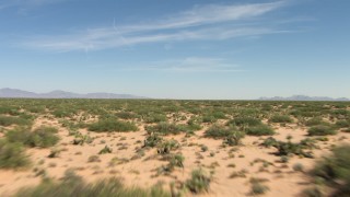 AF0001_000913 - HD stock footage aerial video of an arid desert plain with vegetation in New Mexico