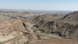 AF0001_000922 - HD stock footage aerial video of passing a quarry to approach smoke stacks in El Paso, Texas