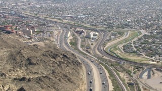 AF0001_000926 - HD stock footage aerial video flyby I-10 and rugged hillside near a densely populated area, El Paso, Texas