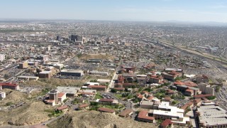 AF0001_000928 - HD stock footage aerial video fly over the University of Texas El Paso to approach Downtown El Paso, Texas