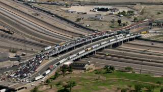 AF0001_000935 - HD aerial stock footage of heavy traffic crossing the Bridge of the Americas, zoom out to a wider view, El Paso/Juarez Border