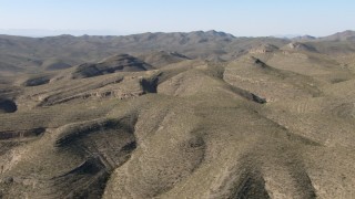 AF0001_000950 - HD stock footage aerial video of flying by dry mountains near El Paso, Texas