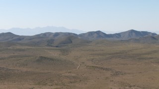 AF0001_000952 - HD stock footage aerial video of an arid plain and mountain ranges near El Paso, Texas