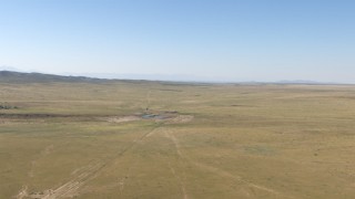 AF0001_000959 - HD stock footage aerial video flyby a small pond in the middle of an arid plain near El Paso, Texas