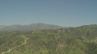 AF0001_000971 - 5K aerial stock footage of Green Verdugo Mountains and hillside homes in Burbank, California