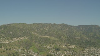 AF0001_000972 - 5K aerial stock footage of suburban neighborhoods beside the Verdugo Mountains in Burbank, California