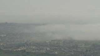 AF0001_000975 - 5K aerial stock footage of low fog over suburban homes in Los Angeles, California