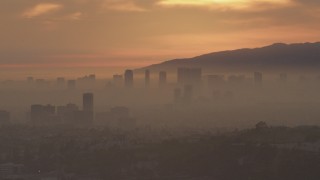 AF0001_000992 - 5K aerial stock footage of a view of Century City skyscrapers at sunset, California