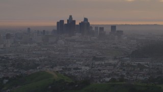 AF0001_000995 - 5K aerial stock footage of a view west at the Downtown Los Angeles skyline at twilight, California