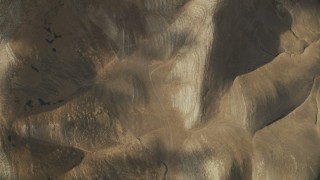 AF0001_001022 - 8K aerial stock footage of a bird's eye view of hills in the Southern California desert