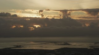 AF0001_001034 - 8K aerial stock footage of cloud formations over the San Mateo Bridge in San Francisco Bay at sunset in California