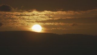 AF0001_001042 - 8K aerial stock footage of a commercial jet flying by the setting sun in Northern California