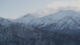 AK0001_0001 - 4K aerial stock footage flying by snow covered Chugach Mountains, Chickaloon, Alaska