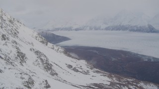 AK0001_0023 - 4K aerial stock footage pan right by Knik Glacier and Chugach Mountains, Knik Glacier, Alaska