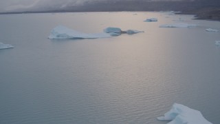 AK0001_0041 - 4K aerial stock footage flying over icebergs on Inner Lake George, tilt down, Inner Lake George, Alaska