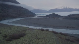 AK0001_0047 - 4K aerial stock footage flying low over a river and approaching a glacier, Knik, Alaska